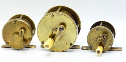A 19th Century 2 &frac34;" brass multiplying winch, turned bone handle on off-set curved crank winding arm, rivetted block foot, triple pillared cage, no check, circa 1850, a similar 1 &frac34;" multiplying winch, foot pierced to take leather pad, circa 1850 and anothe