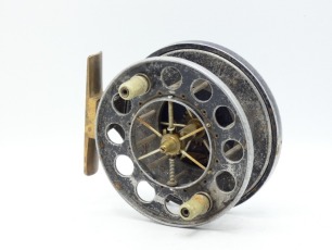 An Allcock Aerial 7950-T10 4" centre pin reel, caged and six spoked drum with twin stepped xylonite handles, ventilated front flange (eight holes) and twin release/regulator forks, brass stancheon foot, rim mounted optional check lever and bar spring che