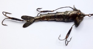 A fine and rare Gregory Superior Flexible Jointed 3 &frac12;" bait, the silver plated five section fish shaped lure with twin amber/black spot glass eyes, incised scale decoration, twin head spinning vanes, on stamped makers name, twin head and one rear gimp mou