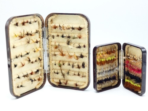 A Hardy Neroda bakelite No.7 Drywet trout fly box, oxblood finish, interior fitted chenille bars and holding a selection of various trout flies and a Hardy Neroda No.8 Drywet waistcoat trout fly box, oxblood finish, fitted chenille bars, holding a selecti