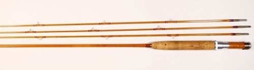 An H.L. Leonard "Model 40" 2 piece cane trout fly rod, 8', #5, two additional spare tips (both short), clear/cane tipped silk wraps, alloy screw grip reel fitting, wooden reel seat, nickel silver suction ferrule, agate lined butt ring, serial no.3073, lig