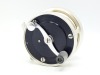 A fine and rare S.E. Bogdan model 100 multiplying salmon fly reel, black/champagne anodised right hand wind model with serpentine crank handle set within an anti-foul rim, block foot, stamped model details, rear milled optional check button and off-set t