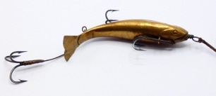 A scarce Livsey's "Swivel-Tail" 2 &frac34;" bait, the hollow brass fish shaped lure with incised decoration, curved tail, stamped maker's details, rear treble and two side mounted double hooks on gimp trace, circa 1890 (see illustration)