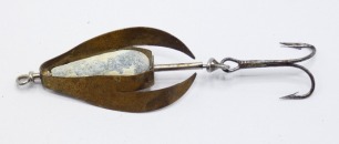 A Chavagnac style 1 &frac12;" brass bait, the cut brass body revolving around a central spindle with pear shaped lead body weight and rear flying treble hook, possibly French, circa 1910