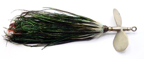 A substantial 6 &frac12;" Halcyon bait, nickel silvered barrel shaped head with two large spinning vanes, peacock herl and white cock feather body dressing and rear fixed treble hook, un-named circa 1900 (see illustration)