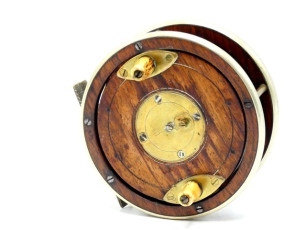 A rare Hancock, Holborn, walnut 4" combination reel, solid walnut drum with twin tapered horn handles on elliptical brass plates, four screw spring drum latch, German silver bound rims, bridge foot, triple cage pillars, rear sliding optional check button