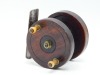 A scarce early Nottingham 2 &frac12;" winch, mahogany drum with twin turned baluster horn handles, milled brass locking nut and single concentric band of decoration, iron caged drum with turned spindle, rivetted iron strap back foot, no check, circa 1850