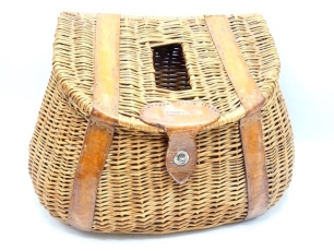 A fine C. Farlow & Co. Ltd. English wicker and leather bound trout fisher's creel, sloping lid with rectangular fish hole and lather strapped hinges, turn key hasp latch, leather escutcheon stamped makers Panton St. address details, canvas and leather sh