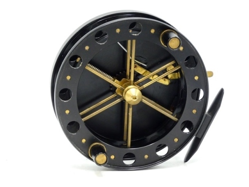 A rare early Paul Witcher "Avon" 4 &frac12;" centre pin, black anodised finish, caged and six spoked drum with twin tapered composition handles, perforated front and rear flanges (ten holes) and rear spoke mounted release fork, rim mounted brass optional check l