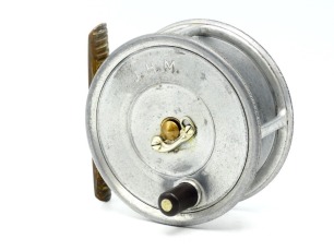 A Hardy Uniqua 3 &frac34;" salmon fly reel "spitfire" alloy with ebonite handle, ribbed brass foot, nickel silver telephone drum latch, fixed Mk.I check mechanism, interior stamped "J.S." (Jimmy Smith), drum face block engraved previous owners initials, circa 19