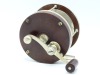 An early Edward Vom Hofe Star model 501 3/0 multiplying bass/tarpon reel, ebonite and nickel silver construction with off-set serpentine crank handle, 2:1 ratio gearing, pierced off-set foot, triple cage pillars, auxiliary leather brake pad, faceplate scr