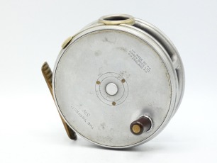 A Hardy Perfect 3 7/8" trout/light salmon fly reel, ebonite handle, ribbed brass foot, white metal line guide, nickel silver milled rim tension screw and Mk.II check mechanism, un-leaded finish, light use and in original brown card box, circa 1940