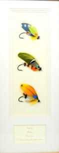 A framed display of three Major Traherne pattern gut eyed salmon flies tied by Jeff Mason to 7/0, 8/0 and 9/0 irons and comprising; Quinchat, Phoebus and May Queen patterns, displayed in recessed stepped card mount, two further single framed gut eyed salm