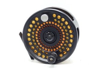 A Lamson LP-7 Spey salmon fly reel and spare spool, black anodised finish, counter-balanced handle, rear off-set tension adjuster, in pouches and card boxes and a Sage GFL 3 piece carbon salmon fly rod, 14', #10, alloy screw grip reel fitting, in bag and 