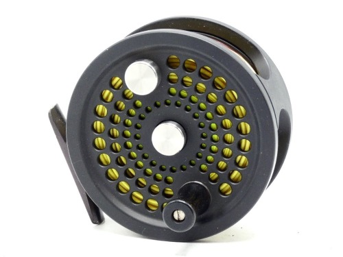 An Abel No.3 salmon fly reel, black anodised finish, counter-balanced rosewood handle, block foot, rear milled spindle mounted tension adjuster, light use only, in pouch and card box (see illustration)