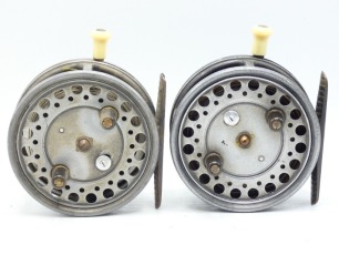 A pair of Hardy Silex Major 3 &frac34;" bait casting reels, each with shallow cored drum, twin ebonite handles, spring drum latch, ribbed brass foot, ivorine handled rim casting trigger, milled rim tension regulator and rear ivorine quadrant weight indicator, on