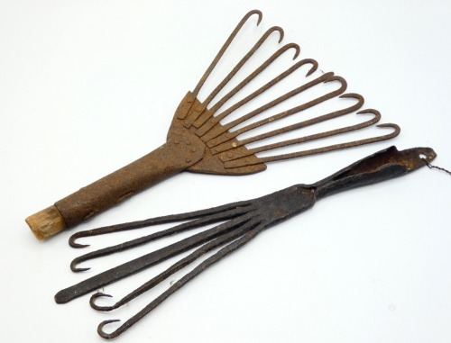 A 19th Century iron eel spear of flared form, nine tines with hooked points, hollow shaft and four further eel and salmon spears of various designs (5)