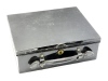 A black japanned rectangular fly dressing case, cream painted interior, leather carry handle, lock a.f., holding a selection of early tying feathers and materials including Indian Crow, Toucan, Owl Macaw et al, in named envelopes