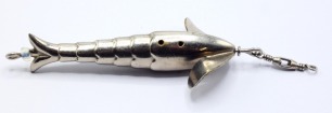 An Allcock (Gregory) Cleopatra 3" white metal bait, stepped, hollow fish shaped body with twin head vanes, central revolving spindle with rear glass bead stop, box head swivel, lacking side and rear treble hook mounts and hooks, circa 1890 (see illustrat