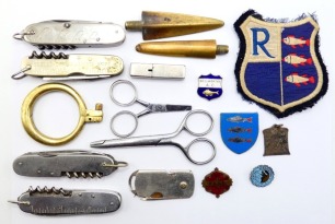 Two Pegley Davies Angler's Knives, fitted various tools, hinged shackles, two similar un-named angler's knives, a brass clearing ring, four angling badges and other items (Q)