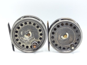 A Hardy Uniqua 4" salmon fly reel, ebonite handle, alloy foot, nickel silver horseshoe drum latch and fixed Mk.II check mechanism, 1920's and a similar Uniqua 3 &frac34;" salmon fly reel, brass foot, fixed Mk.II check mechanism, 1920's both with light wear from