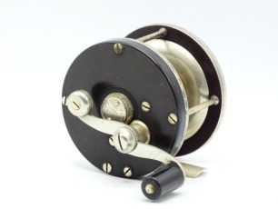 An early Edward Vom Hofe Regal model 491 No.1 casting reel, ebonite and nickel silver construction with off-set counter-balanced serpentine crank handle, pierced foot stamped size and "232" rim mounted rim drag control disc, hinged spindle port covers sta