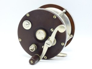 An Edward Vom Hofe Special Celebrated Star 6/0 model 501 multiplying tarpon reel, ebonite and nickel silver construction with off-set counter-balanced "S" scroll handle, anti-reverse spring button, sliding optional check disc, rim mounted casting control