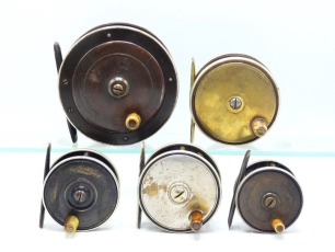 A Heaton's made brass and ebonite 3 &frac34;" salmon fly reel, horn handle, twin German silver bound rims, bridge foot, triple cage pillars, fixed check and four brass and ebonite trout fly reels, German silver bound rims, one with nickeled silver finish, all ci