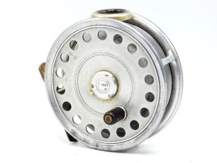 A scarce Hardy St George 3 &frac34;" spitfire alloy trout fly reel, shallow cored drum with ebonite handle and three screw spring drum latch, brass foot, white agate line guide (no cracks), milled rim tension screw and Mk.I check mechanism, interior stamped "J.S