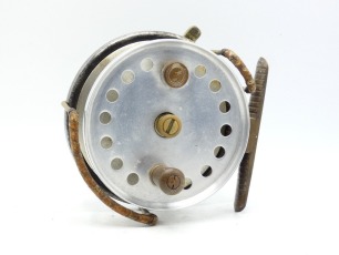 A rare Hardy Longstone Mallet pattern 4 &frac12;" Dorado centre pin reel, polished alloy drum with counter-balanced reverse tapered ebonite handle, unusual single band of perforations only (catalogued with double band) and milled nickel silver tension nut, ribb