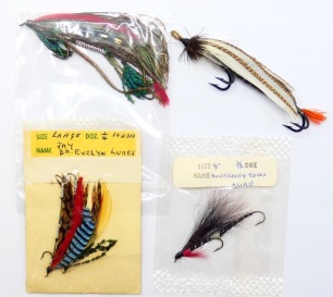 A Hardy No.2 Norsk Lure, plain pattern, tandem hooks, gut eye, two Dr Evelyn Jay lures, in packet, a size 8 Sweeney Todd tandem lure and a Demon tandem lure (5)