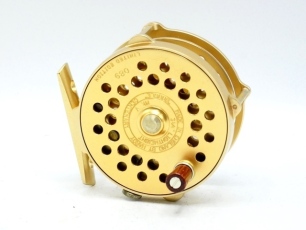 A scarce Hardy Bougl&eacute; Mk.V Centenary 3 &frac14;" trout fly reel, limited ed. 89/100 with gold anodised finish, rosewood handle, multi-perforated drum, cage and faceplate, pierced bridge foot, triple raised pillars (one nickel silver roller), rim tension regulat
