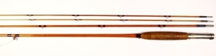 An H.L. Leonard "The Leonard" 3 piece (2 tips) cane trout fly rod, 9', dark tan/crimson tipped silk wraps, nickel silver reel seat with sliding locking band and butt cap stamped makers cartouche, swollen butt, cigar shaped cork handle, agate line butt and