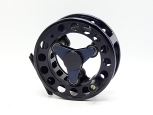 A Loop Model 3W salmon fly reel, black anodised finish, large arbour skeletal drum on triform bearing rollers, rear milled tension adjuster, light wear from normal use