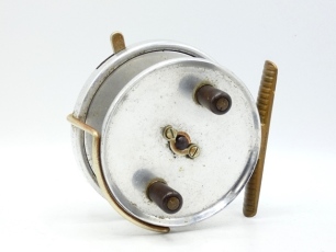 A scarce Hardy Longstone General Harrison pattern 4 &frac12;" sea centre pin/casting reel, solid drum with twin reverse tapered ebonite handles and nickel silver drop bar telephone release latch, ribbed brass foot, Bickerdyke line guide, rim mounted nickel si