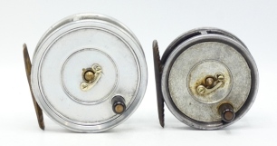 A Hardy Uniqua 3 1/8" trout fly reel, ebonite handle, brass foot, nickel silver telephone drum latch, fixed Mk.II check mechanism, un-leaded finish, interior stamped "J.S." (Jimmy Smith), in card box, 1930's and a similar Uniqua 2 5/8" trout fly reel of 