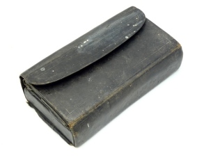 A 19th Century rexine rectangular coarse fisherman's companion wallet, interior fitted rosewood and bone spindled four section float and line winder with central cap and shot compartment with sliding lid, fold out panels of parchment hook/trace compartme