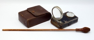 An unusual treen sea disgorger, the hollow segmented bulbous head stamped "patent 17389" and mounted on long slender handle, 14" long, circa 1900 and a Compleat Angler's Lamp, rectangular tin case, hinged magnifying lens, swivelling hanging clip, applied 