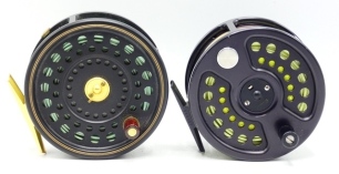 A Hardy Pall Mall Centenary #10/11 salmon fly reel, black/gold anodised finish, rosewood handle, two screw drum latch, brass foot, adjustable dual compensating check mechanism, light use, in modern Selvyt bag and a Hardy Sovereign 2000 #12/13 salmon fly r