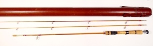A fine and rare L.H. Design (Leen Huisman) Ultralight 2 piece (2 tips) hand built cane spinning rod, 6'3", 5g, tan/black tipped silk wraps, burr walnut reel seat with screw grip reel fitting, tungsten guides, nickel silver suction ferrule, only very light