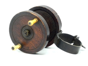 A rare 19th Century Nottingham clamp fitting winch, the 2 &frac12;" walnut drum with twin slender baluster bone handles, iron cage pillars, "hour glass" drum core and milled brass locking nut, iron strap back foot, rivetted brass clamp fitment with thumb locking