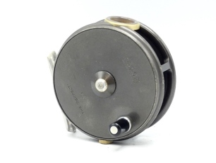 A Hardy Perfect 3 3/8" trout fly reel, ebonite handle, alloy foot, white agate line guide (no cracks), milled rim tension screw and dual compensating check mechanism, raised spindle boss to faceplate, only very light signs of use, 1970's
