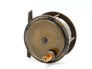 A scarce Allcock Duplex patent 3 &frac12;" brass salmon fly reel, raised faceplate with tapered horn handle mounted above a milled cup which disengages the alloy drum into free spool when rotated, brass arboured alloy drum, bridge foot, triple cage pillars, rear