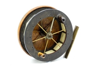 An exceptionally rare first model Coxon Aerial 4" centre pin reel, ebonite flanged drum with six spokes, twelve brass cage pillars, twin horn handles and fork mounted drum release latch, walnut backplate with brass starback foot, stamped "patent" and no c