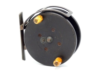 A rare J.W. Young designed Allcock Simplex 3 &frac12;" centre pin reel, the solid ebonite drum with twin domed horn handles, spring release latch, brass drum arbour, brass foot with twin arm spindle mounted stancheon, sliding optional check button and integral