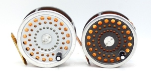 A Hardy Marquis Salmon No.2 fly reel and three spare spools, composition handle, ribbed brass foot, two screw drum latch and rear tension adjuster and a Hardy Marquis Salmon No.1 fly reel of similar design, in zip cases (2)