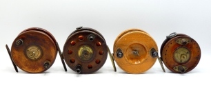 A Carter & Co. 4 &frac12;" Nottingham centre pin reel, walnut drum with twin ebonite handles and three screw spring drum latch, starback brass foot with optional check button and calliper spring check mechanism, an Eton Sun 4 &frac12;" Nottingham centre pin reel and t
