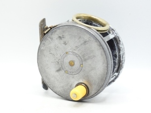 A Hardy Perfect 4 &frac14;" salmon fly reel, domed ivorine handle, brass foot, revolving nickel silver line guide, strapped rim tension screw with Turk's head locking nut and 1912-17 heavy duty check mechanism, drum with four rim cusps and milled nickel silver 