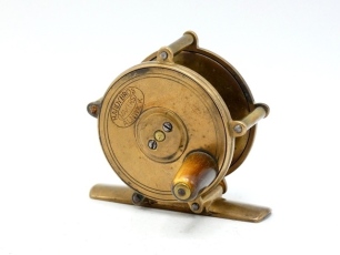 A rare Hardy Raised Pillar 2" brass trout winch, tapered horn handle, bridge foot, triple raised drum pillars, fixed check mechanism, faceplate with raised two screw spindle boss and stamped enclosed oval logo, a rarely seen example of the smallest sized