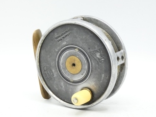 A very rare Hardy Transitional Perfect 3 1/8" alloy trout fly reel, domed ivorine handle, brass foot, triple cage bridges each pierced two holes, very rarely seen model with fixed calliper spring check mechanism and no ball bearing race, slightly contrac